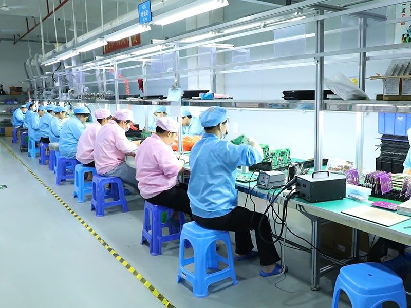 DIP through-hole assembly line with operators